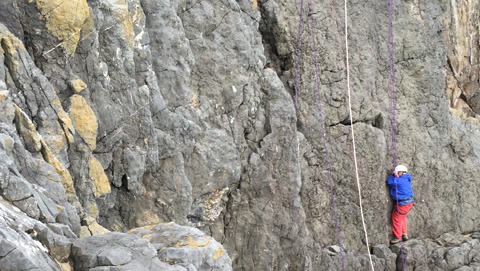 A person doing outdoor climbing in South Wales.