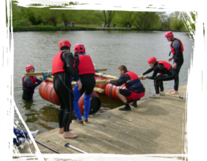 One team building a raft as part of their raft team building activity.