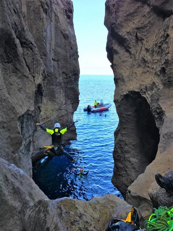 A person jumping off a cliff in Majorca