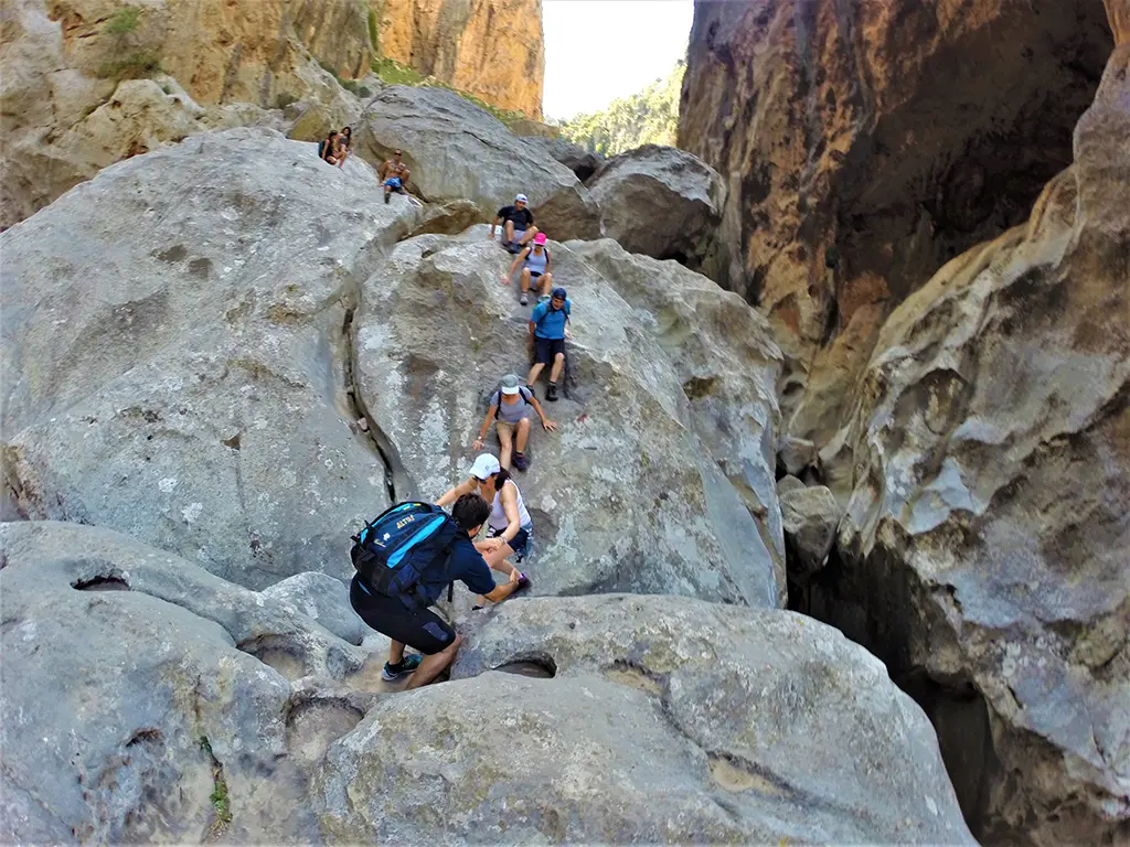 Group of people rock climbing in Majorca