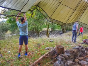 campers setting up a tent