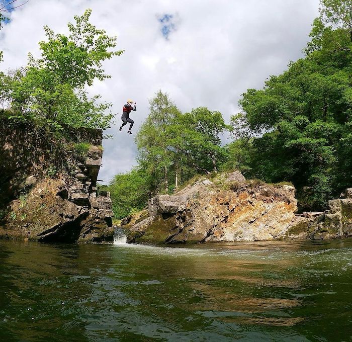 person jumping in water