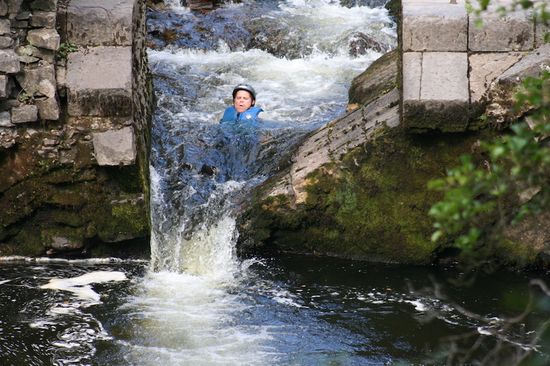 Waterfall slide during gorge walking in Wales