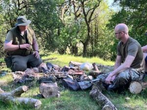 Two men in a wild camping adventure for their stag do activity in Cardiff