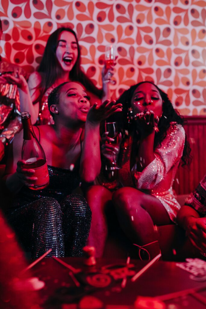 Ladies blow kisses to the camera as they celebrate the bride-to-be on her hen-do night out.