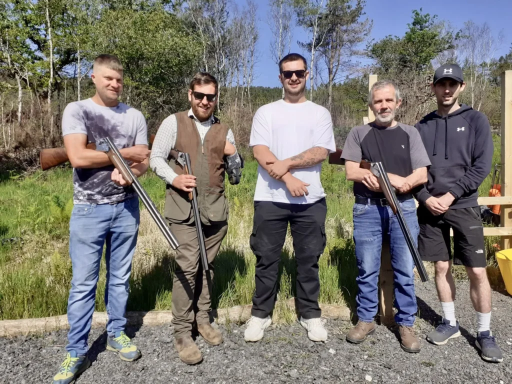 Group of men ready for clay pigeon shooting in Wales