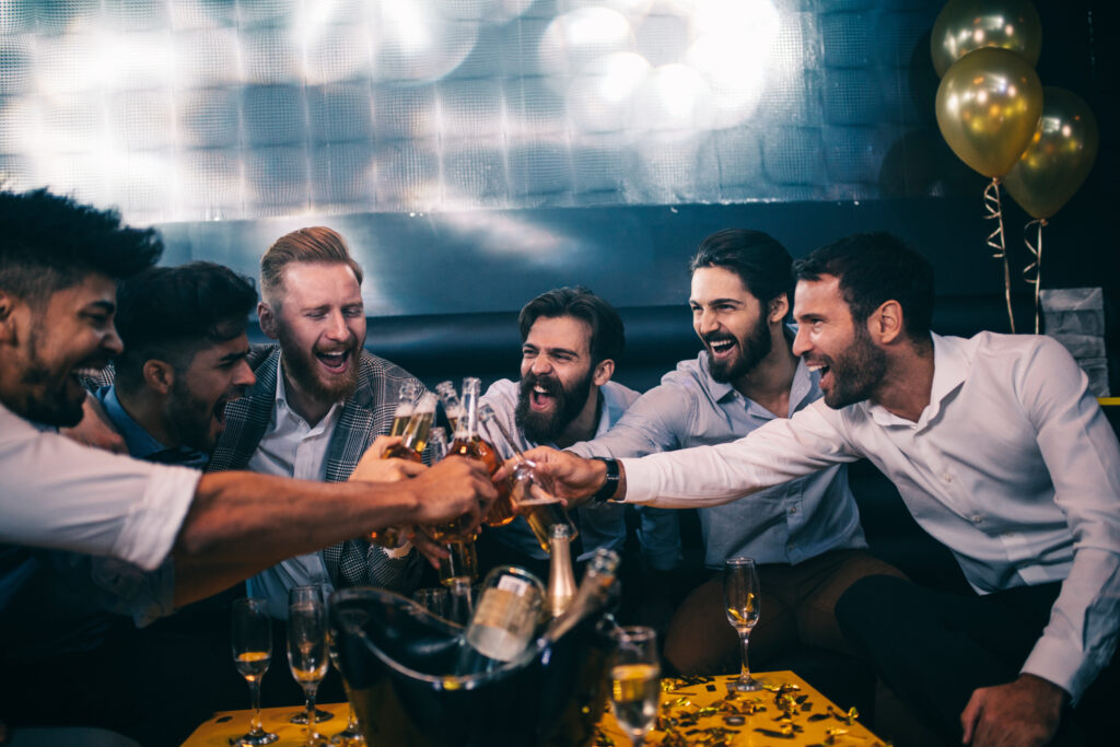 Group of men having a toast on a stag weekend in Wales