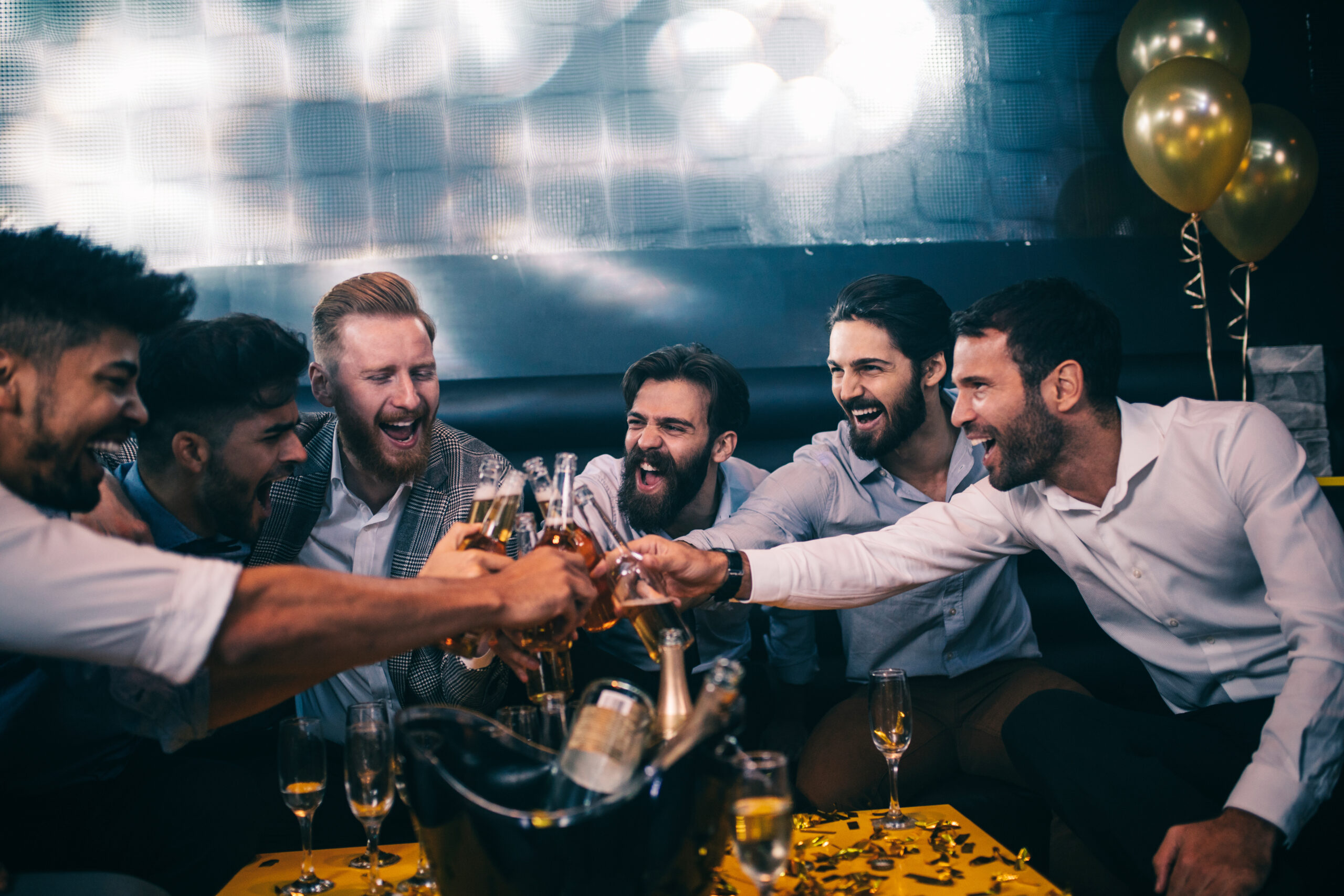 Group of men having a toast on a stag weekend in Wales