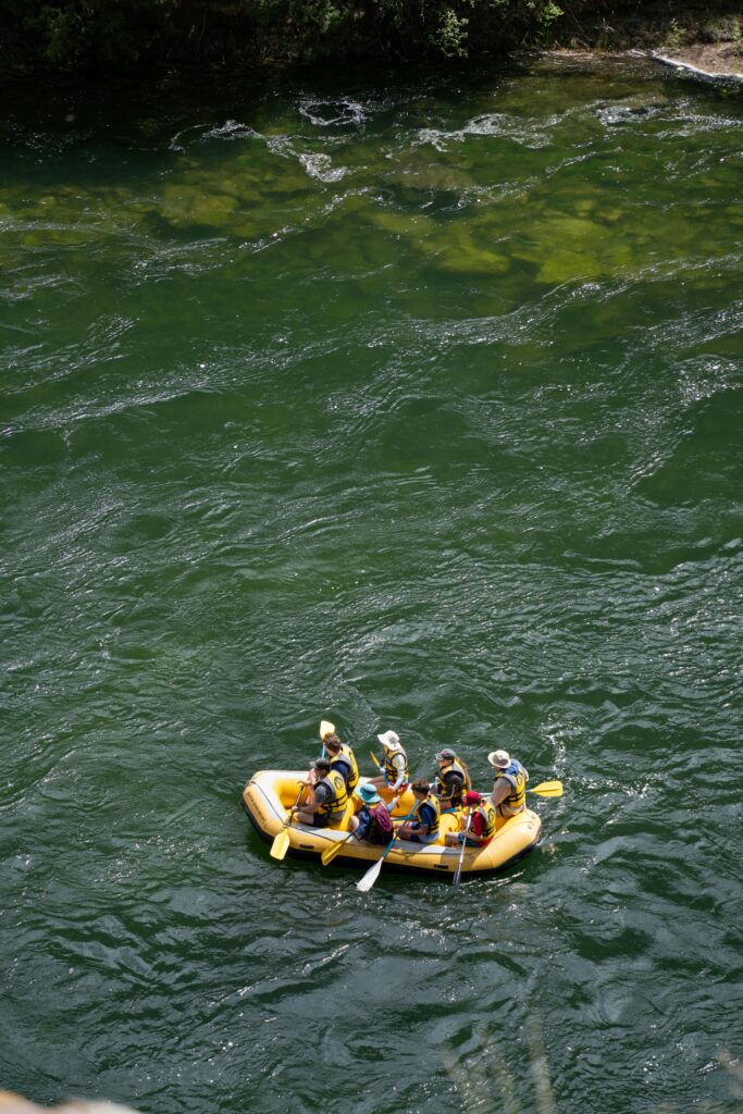 Outdoor team building event, rafting on a river.