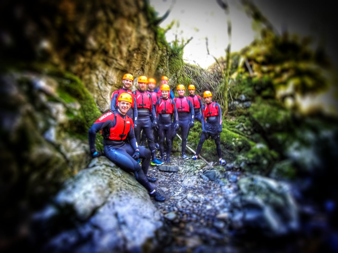 Group of people enjoying a gorge walking adventure in Wales.