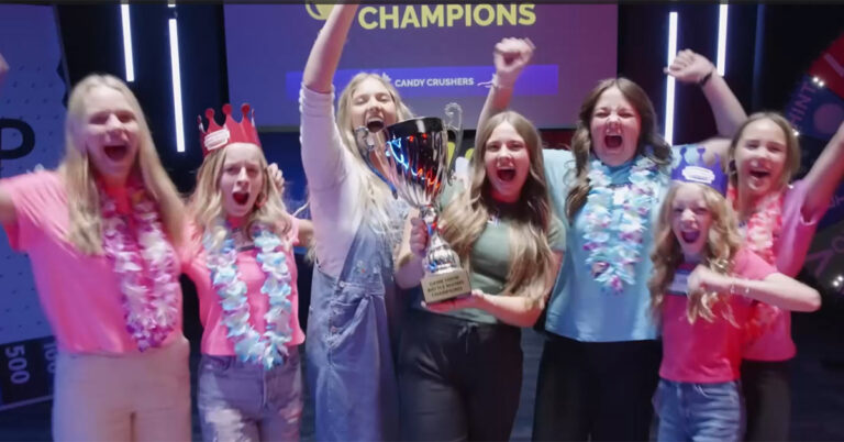 A team celebrating their victory at a game show