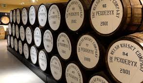 A stack of whiskey barrels at Penderyn Distillery