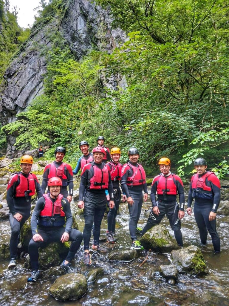 Group of gorge walking adventurers posing for a photo
