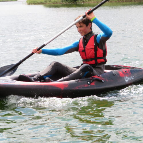 A young man kayaking on River Wye