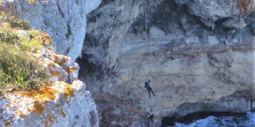 person abseiling into water in Majorca