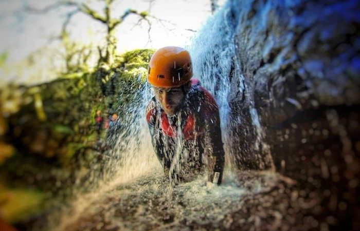 action shot of face under waterfall